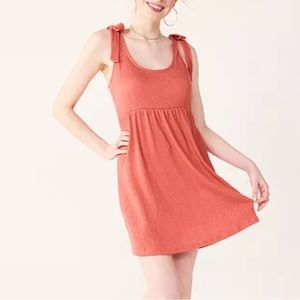 NWT Juniors' SO® Tie Strap Babydoll Mini Dress in “beachside coral”. Size Small